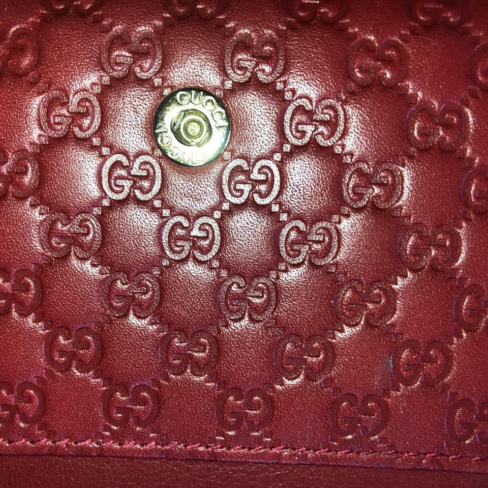 Portafoglio Gucci Guccissima in pelle rosso