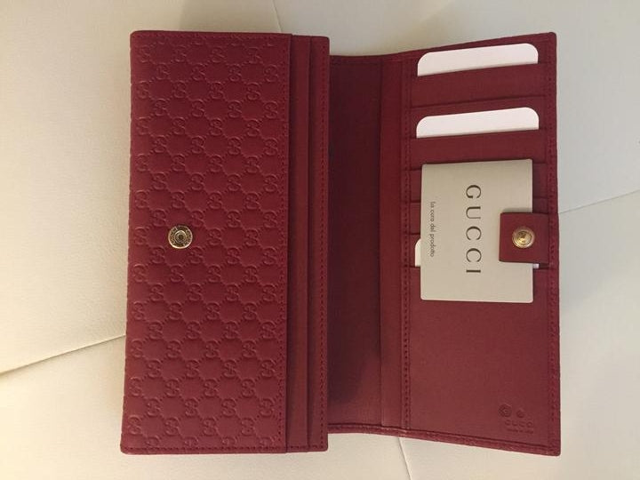 Portafoglio Gucci Guccissima in pelle rosso