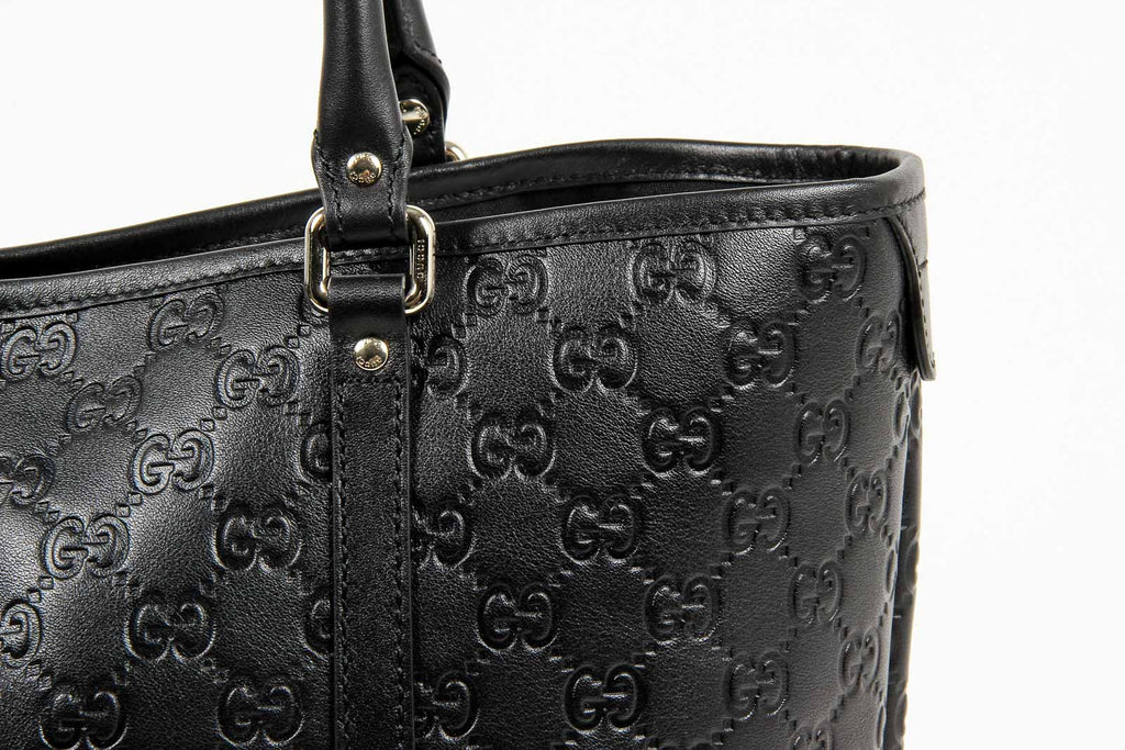 Borsa a mano Gucci da donna in pelle Guccissima nera con logo GG