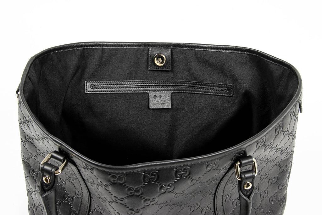 Borsa a mano Gucci da donna in pelle Guccissima nera con logo GG
