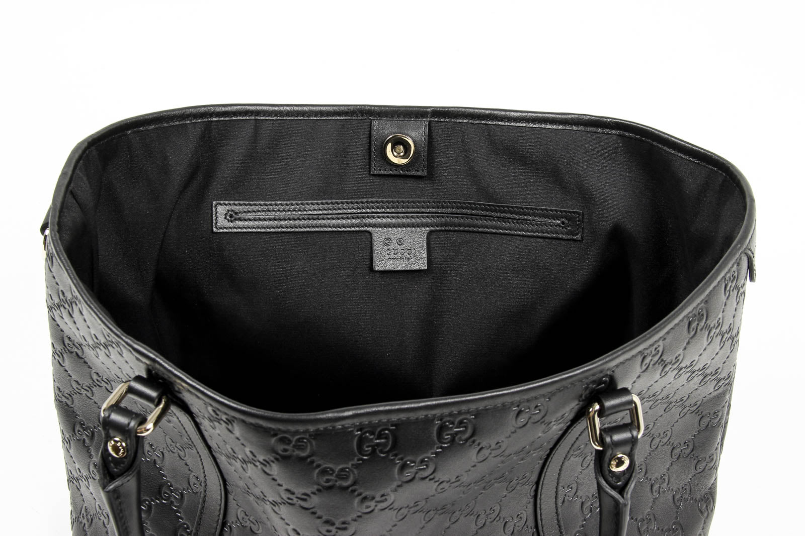 Borsa a mano Gucci da donna in pelle Guccissima nera con logo GG
