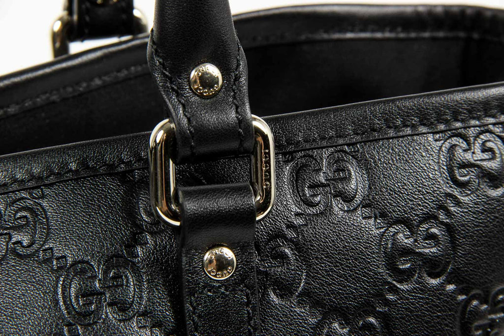 Borsa a mano Gucci da donna in pelle Guccissima nera con logo GG